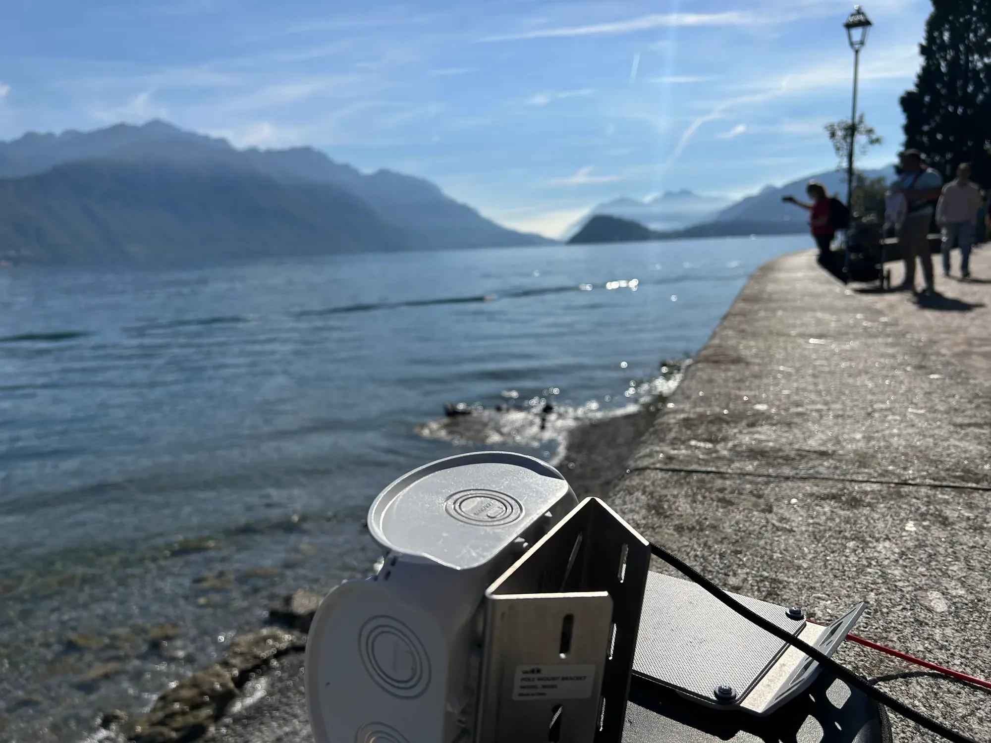 Close-up of the unit and its bracket over the water at Lake Como