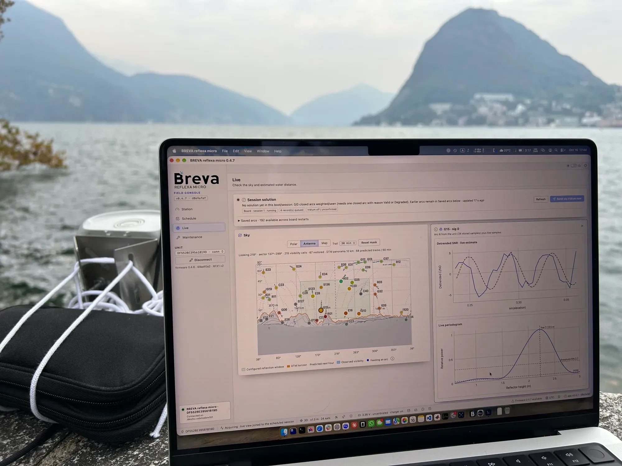 The unit and a laptop on a lake-side wall